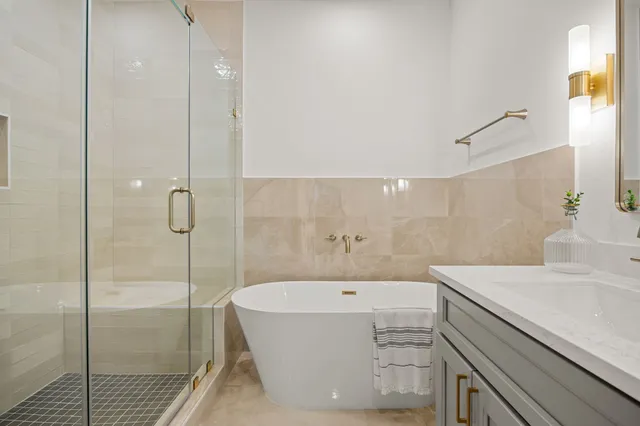 a bedroom with a bed and a couch