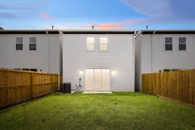 an aerial view of residential building with green space
