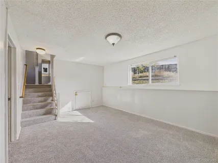 a view of an empty room with a window