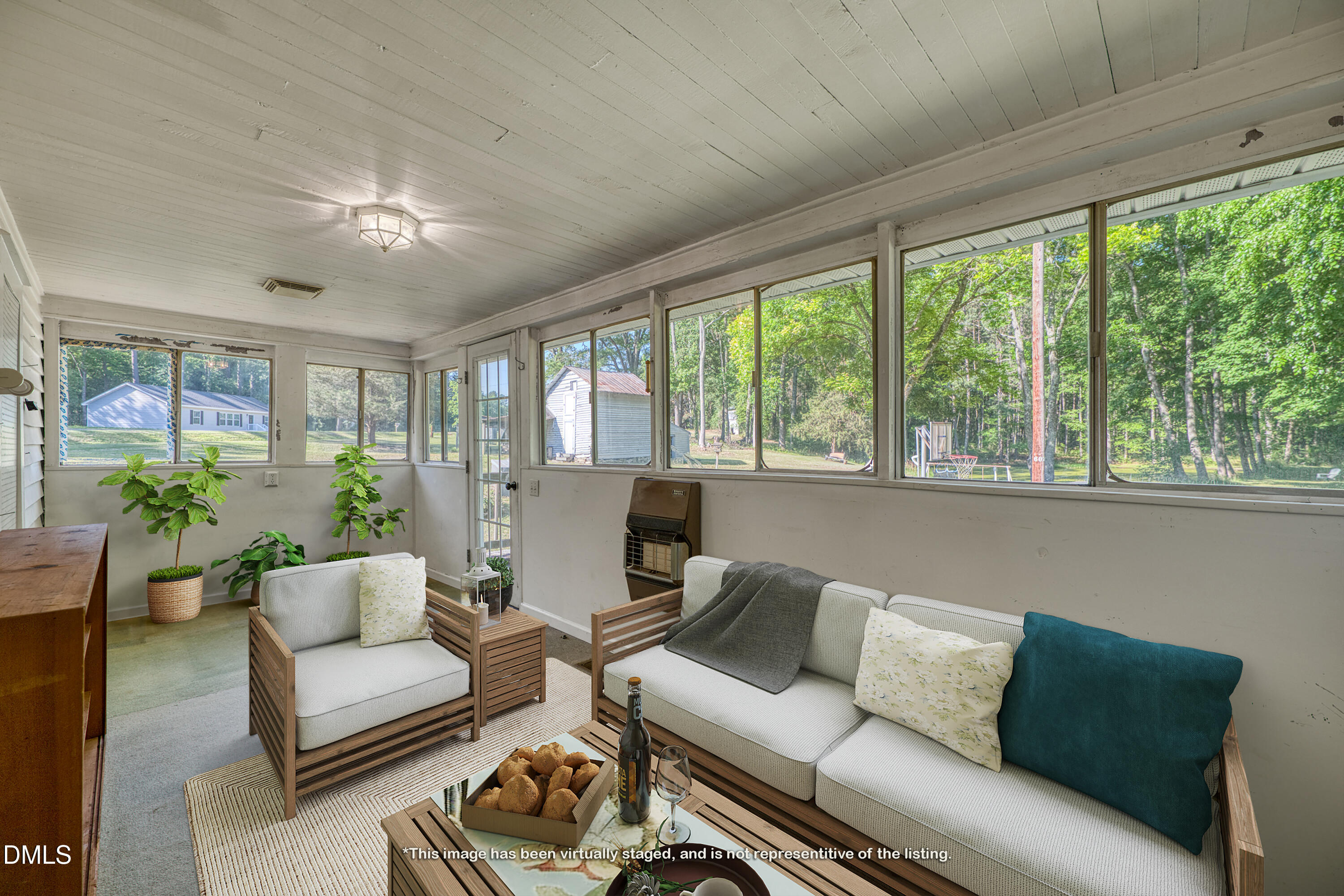 50 Robert Sledge Road Spring Hope, NC 27882 - Photo 23 of 50 a living room with furniture and a large window