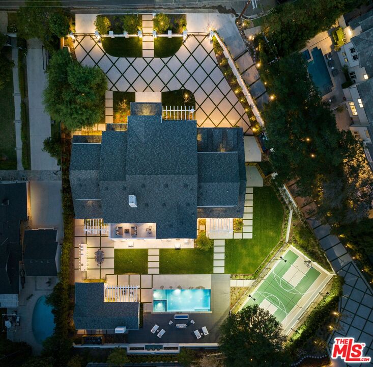 an aerial view of a house with garden space ocean view