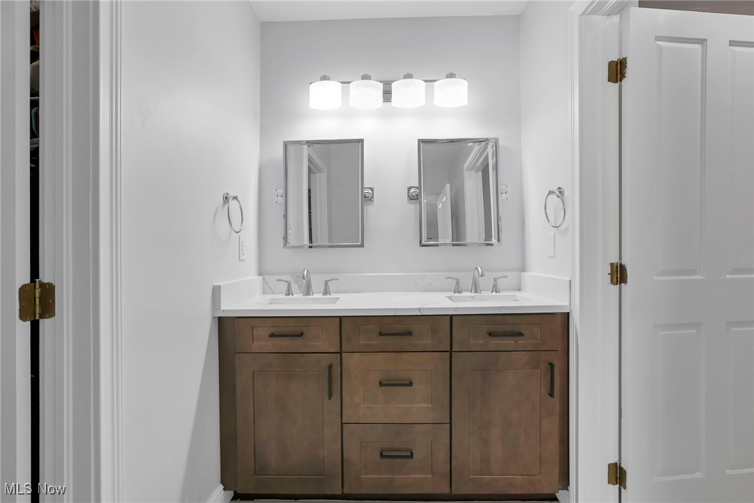 1890 Baltimore Road Northwest Lancaster, OH 43130 - Photo 35 of 50 Bathroom featuring dual bowl vanity