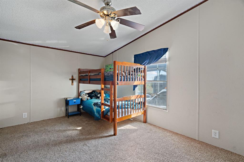 2005 Atticus Court Springtown, TX 76082 - Photo 12 of 15 a view of an empty room with a fan
