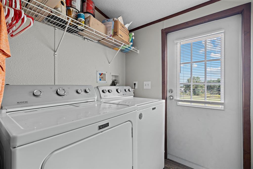 2005 Atticus Court Springtown, TX 76082 - Photo 13 of 15 a utility room with dryer and washer