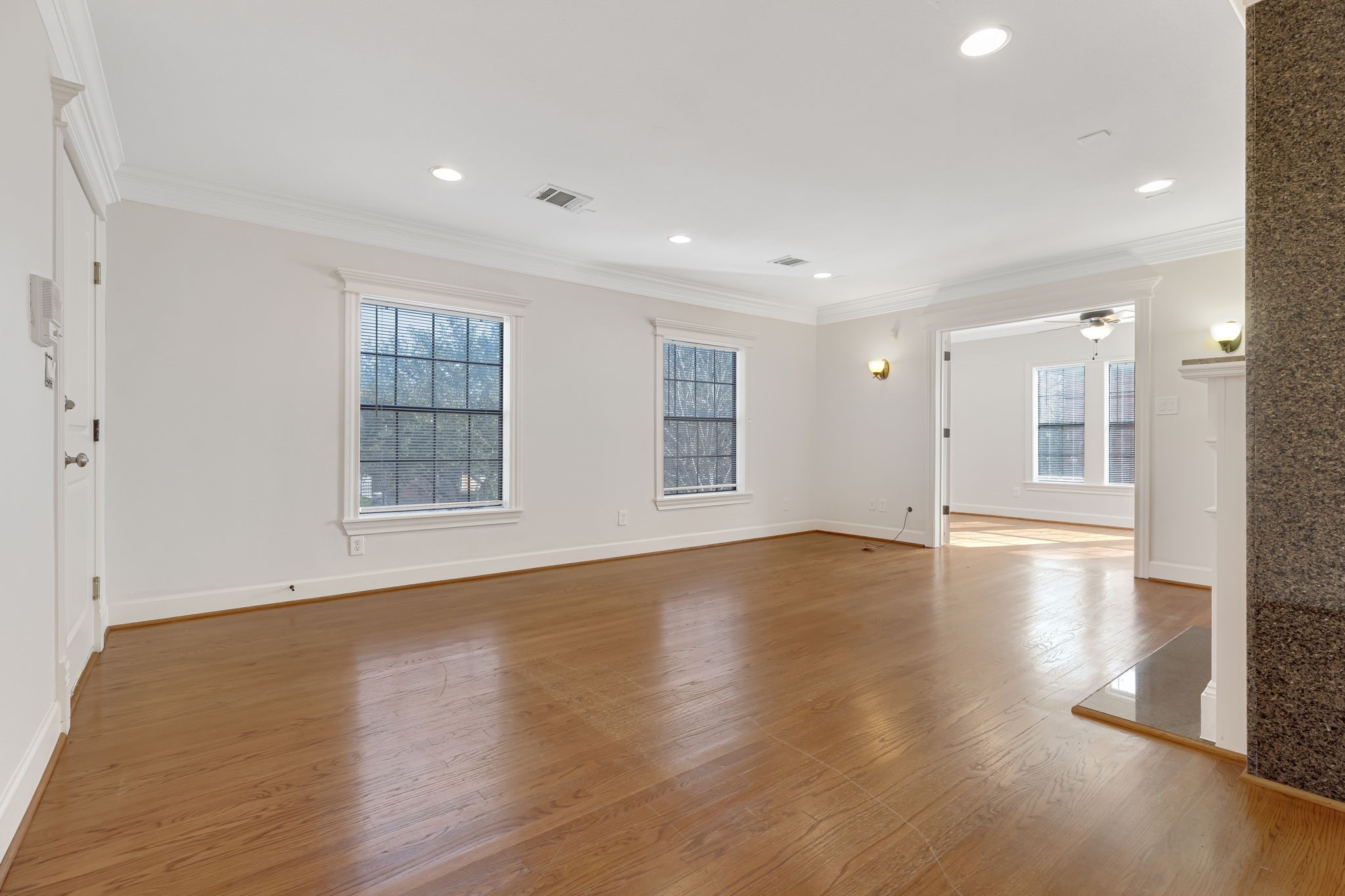 2306 Blodgett Street, Unit 2 Houston, TX 77004 - Photo 3 of 12 a view of empty room with wooden floor and windows
