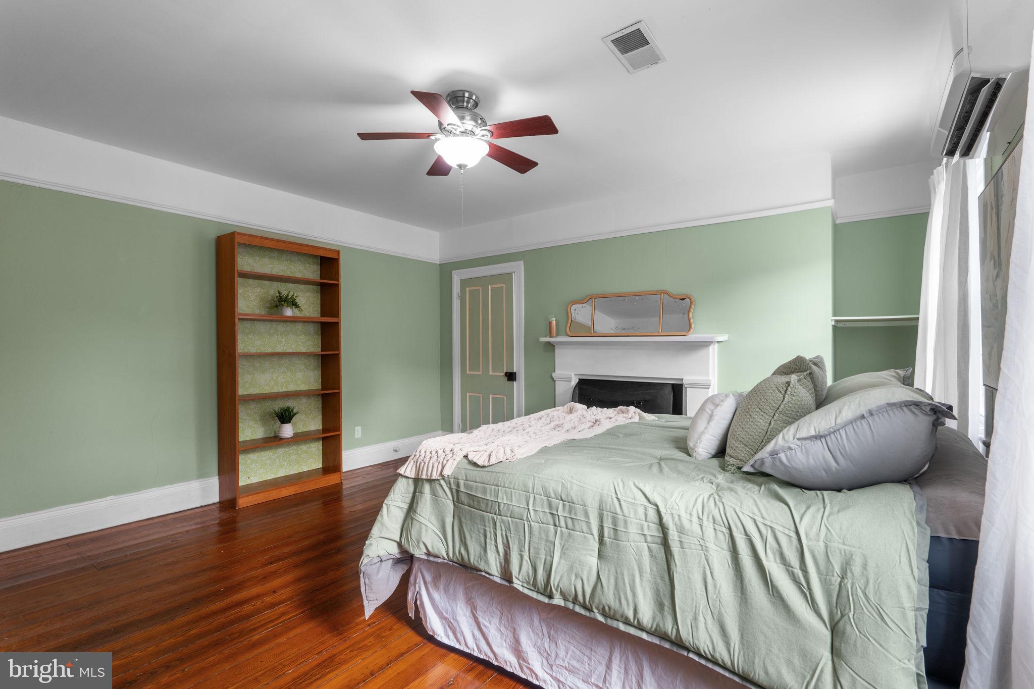 10007 Croom Road Upper Marlboro, MD 20772 - Photo 131 of 134 a bedroom with a bed and a chandelier