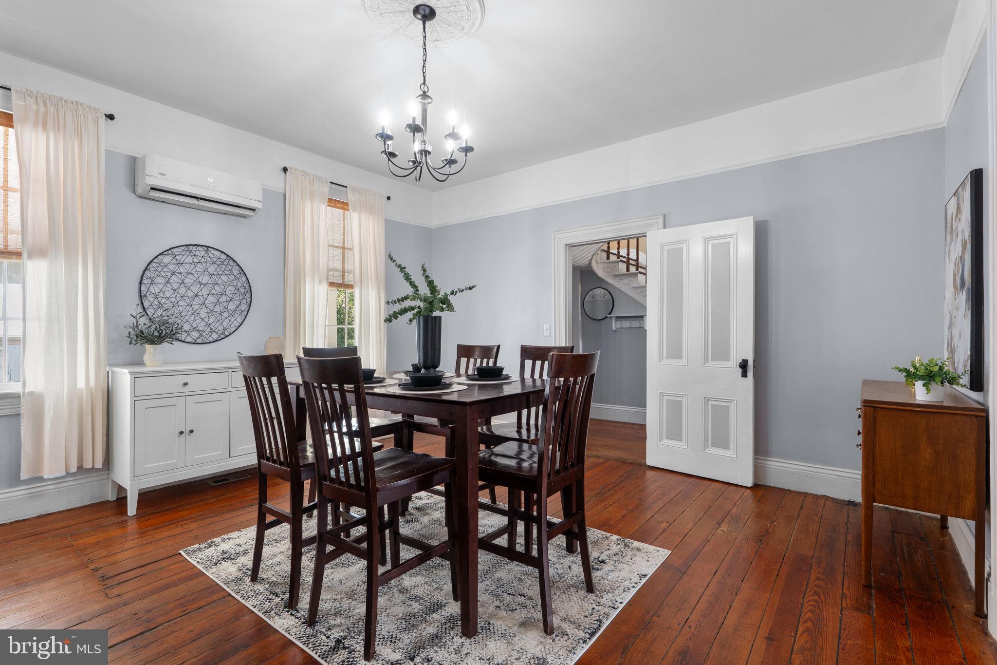10007 Croom Road Upper Marlboro, MD 20772 - Photo 24 of 134 a view of a dining room with furniture window and wooden floor