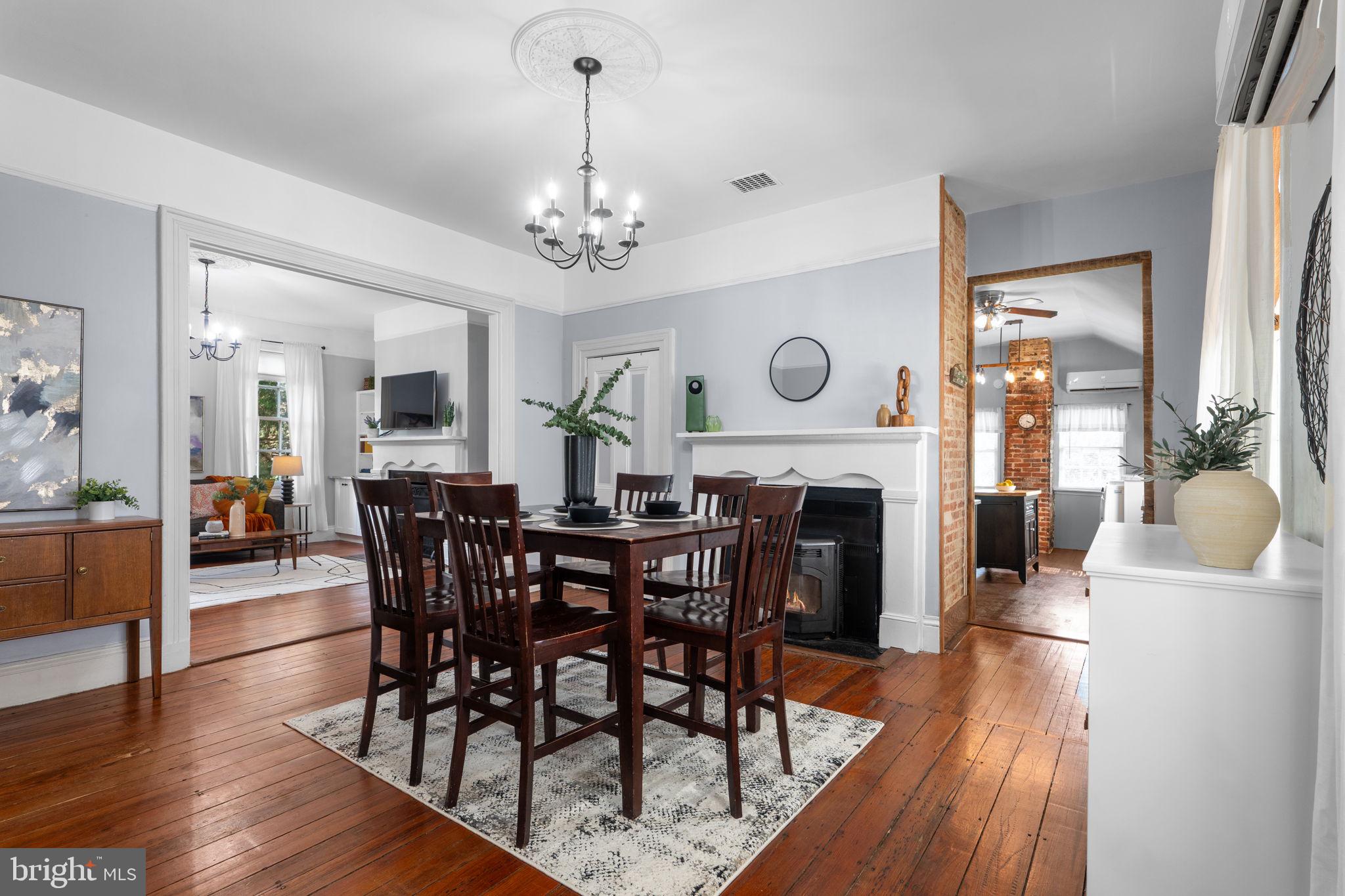 10007 Croom Road Upper Marlboro, MD 20772 - Photo 28 of 134 a view of a dining room with furniture wooden floor and chandelier