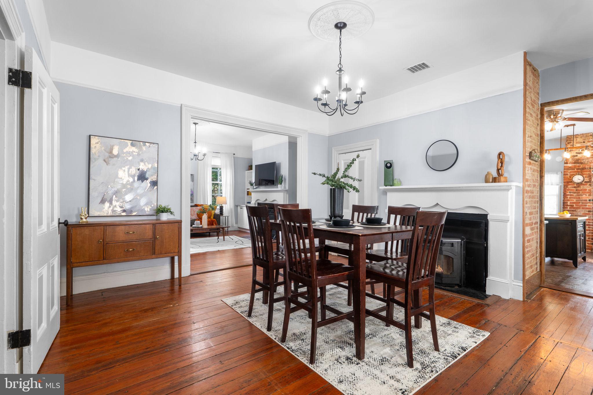 10007 Croom Road Upper Marlboro, MD 20772 - Photo 29 of 134 a view of a dining room with furniture wooden floor and chandelier