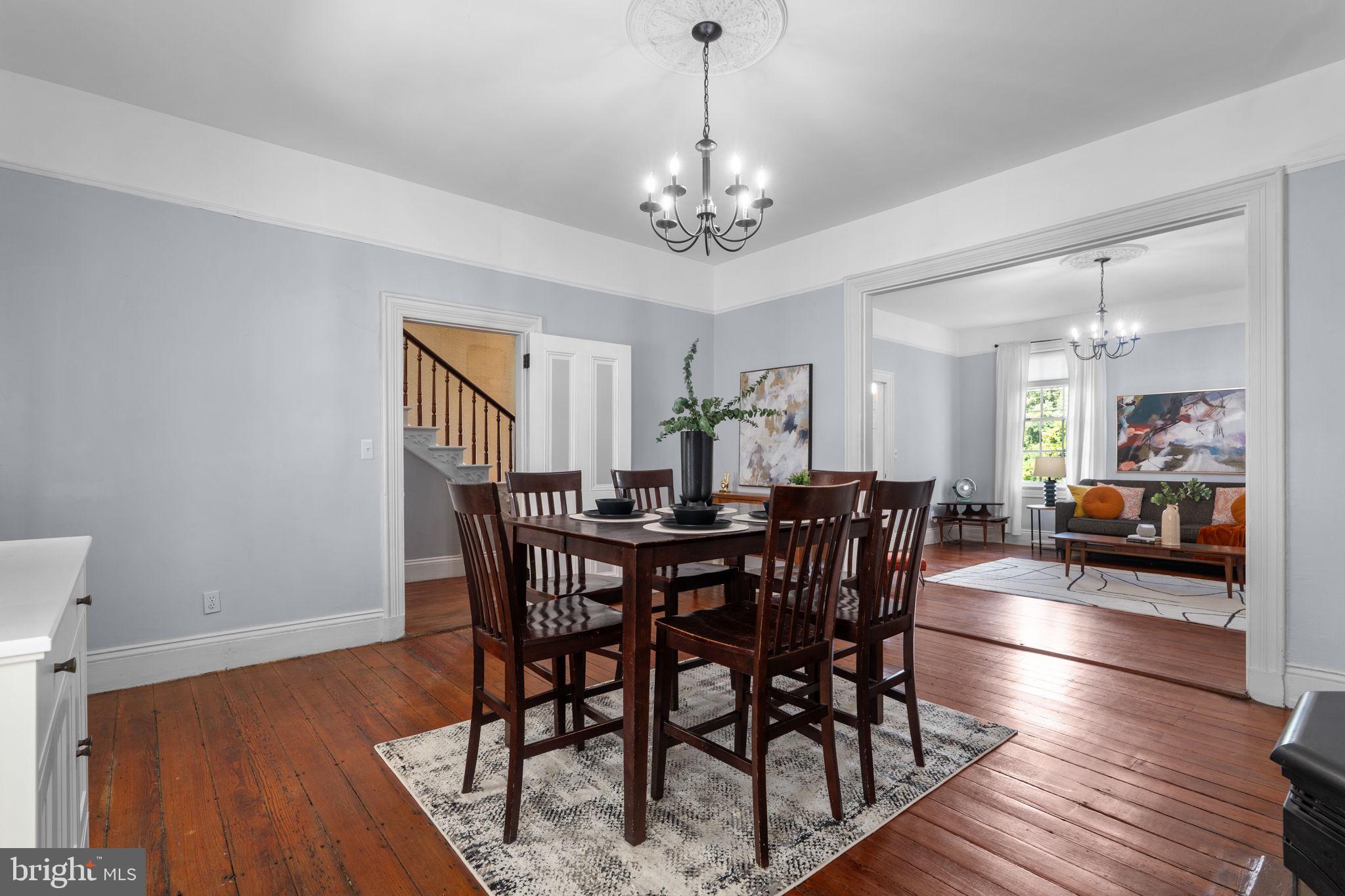 10007 Croom Road Upper Marlboro, MD 20772 - Photo 30 of 134 a view of a dining room and livingroom with furniture wooden floor a chandelier