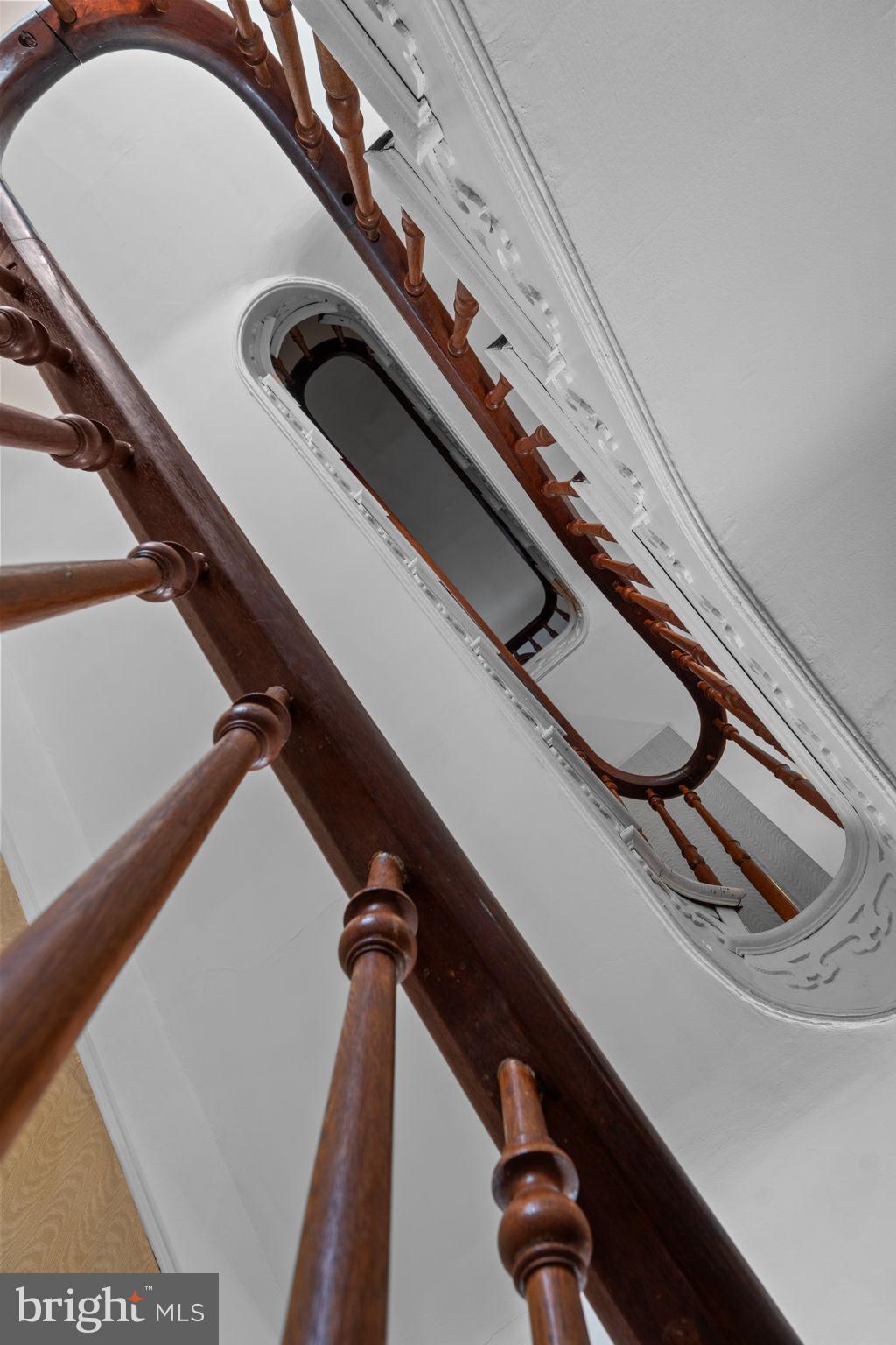10007 Croom Road Upper Marlboro, MD 20772 - Photo 33 of 134 Hairpin staircase, curved wood railings to 3rd fl