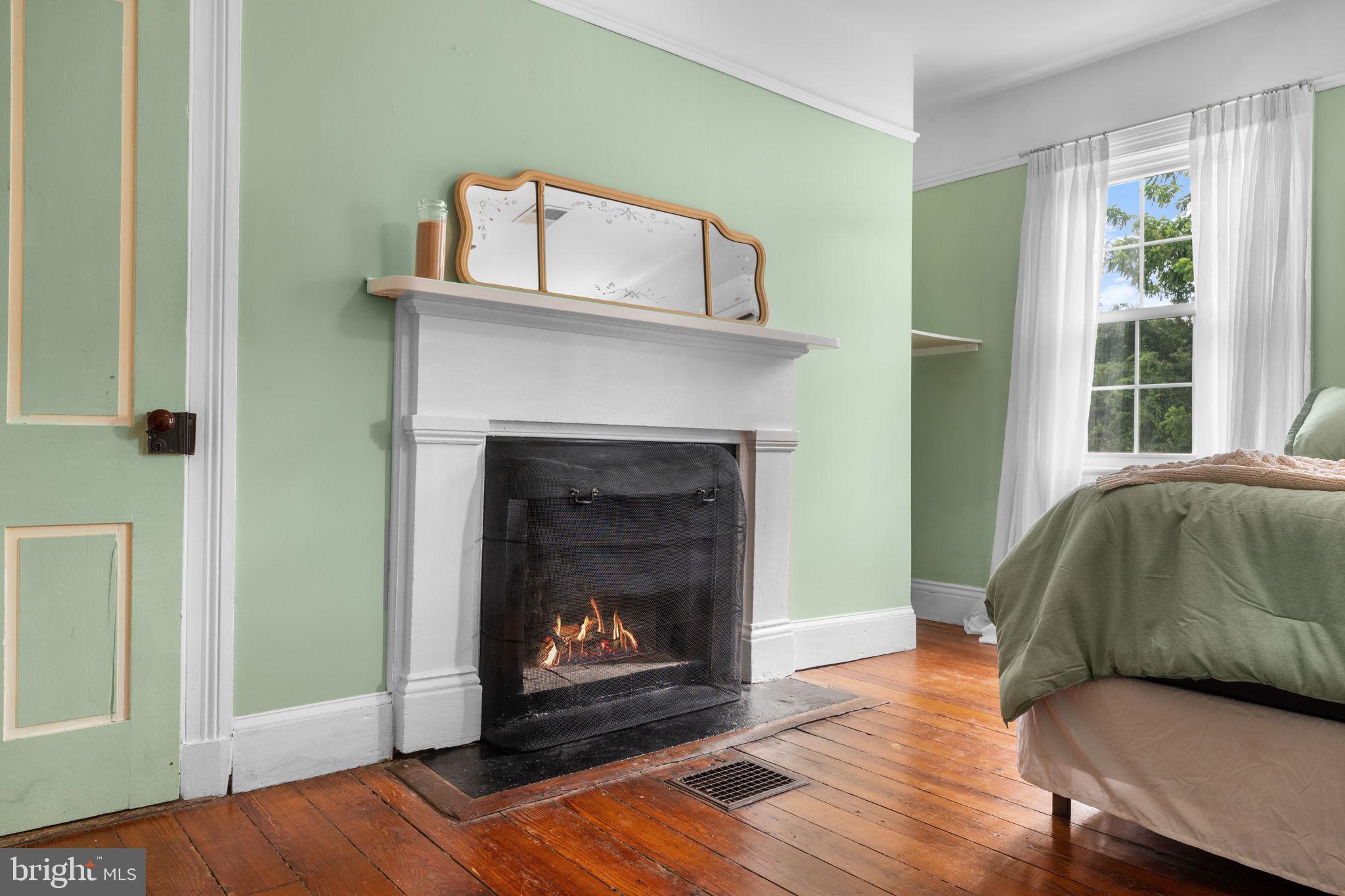 10007 Croom Road Upper Marlboro, MD 20772 - Photo 39 of 134 a living room with furniture and a fireplace