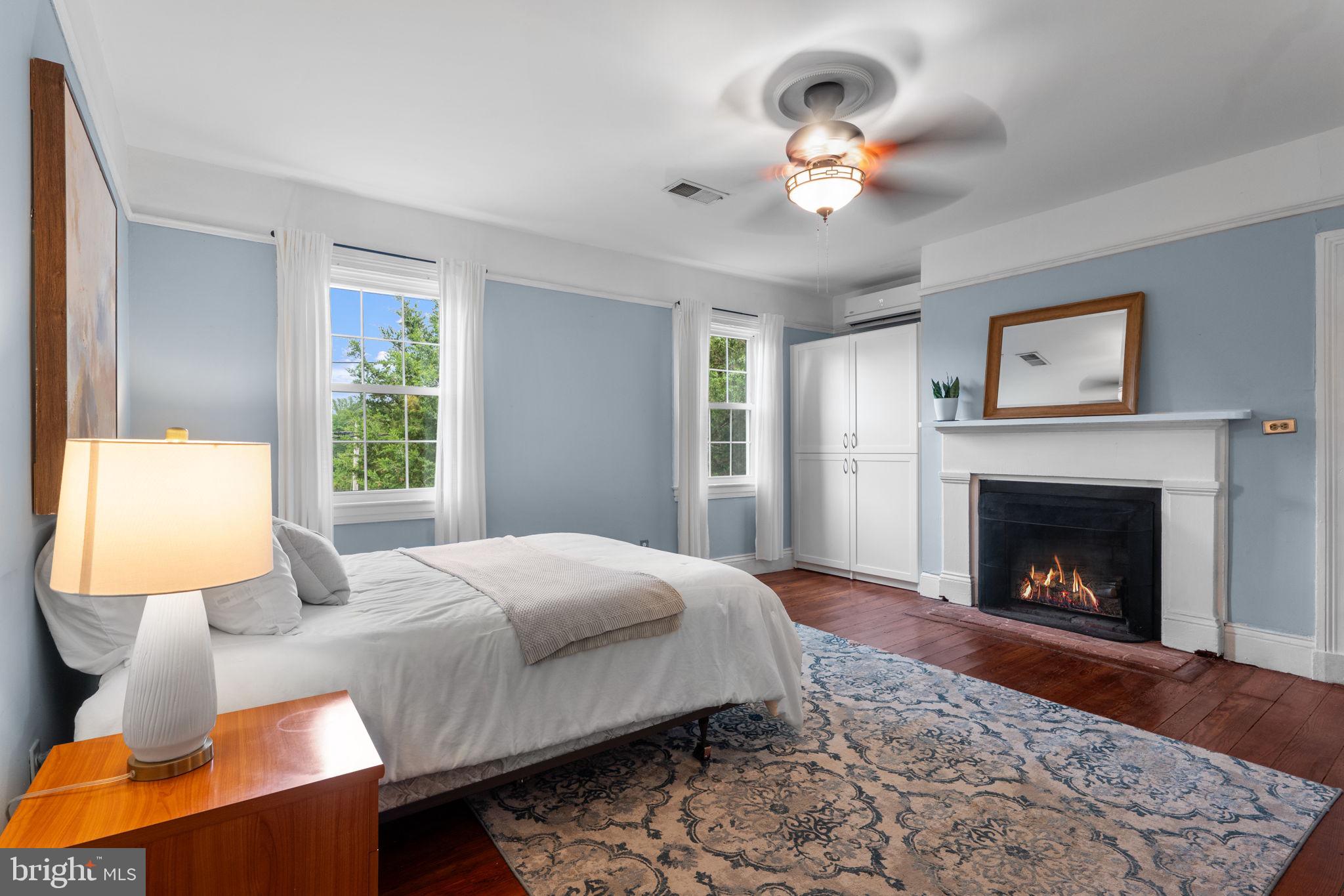 10007 Croom Road Upper Marlboro, MD 20772 - Photo 46 of 134 a bedroom with a bed and a fireplace