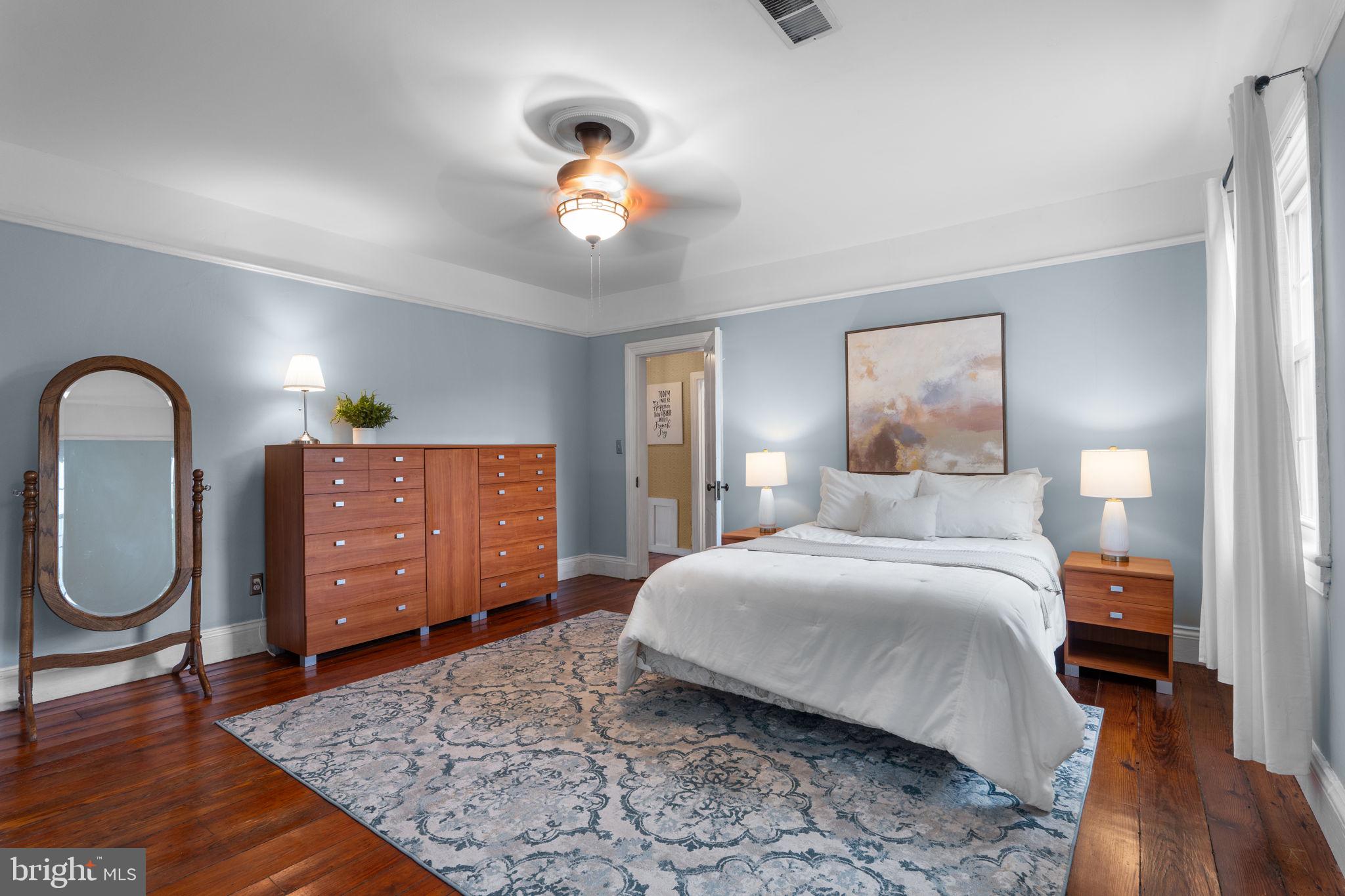 10007 Croom Road Upper Marlboro, MD 20772 - Photo 47 of 134 a bedroom with a bed and a dresser