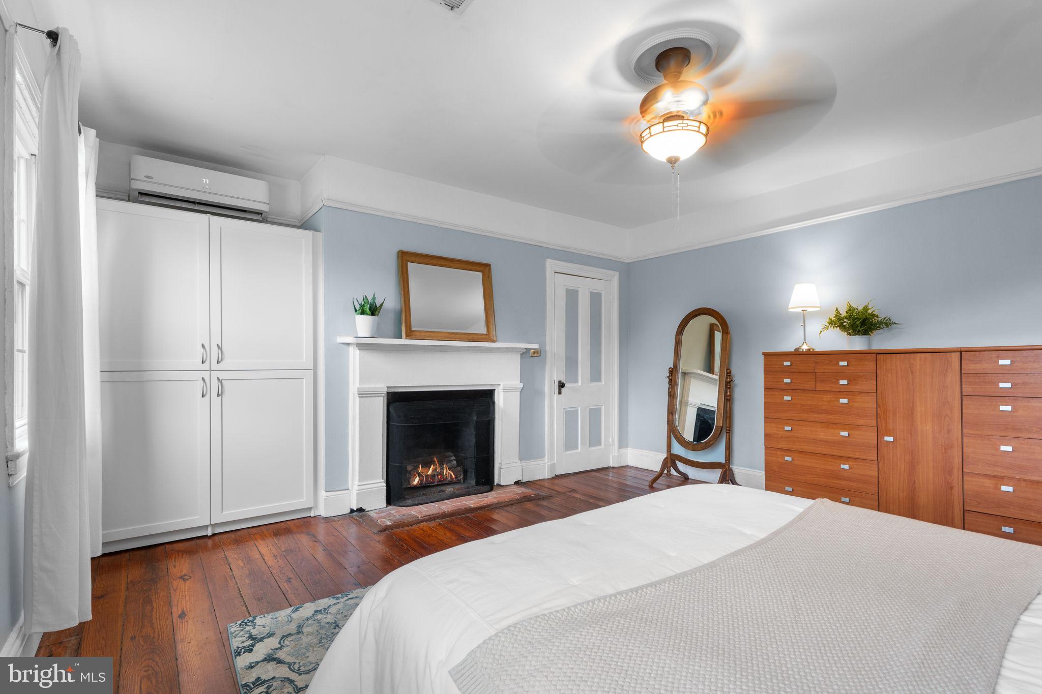 10007 Croom Road Upper Marlboro, MD 20772 - Photo 49 of 134 a bedroom with a bed and a chandelier