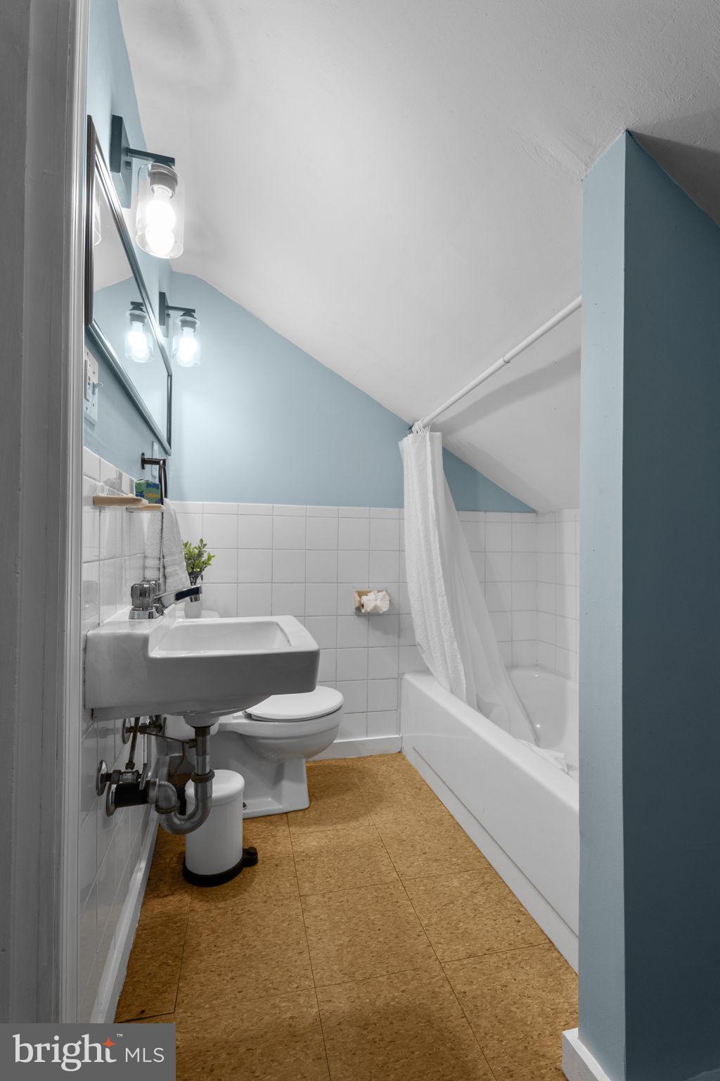 10007 Croom Road Upper Marlboro, MD 20772 - Photo 66 of 134 a bathroom with a sink toilet and shower