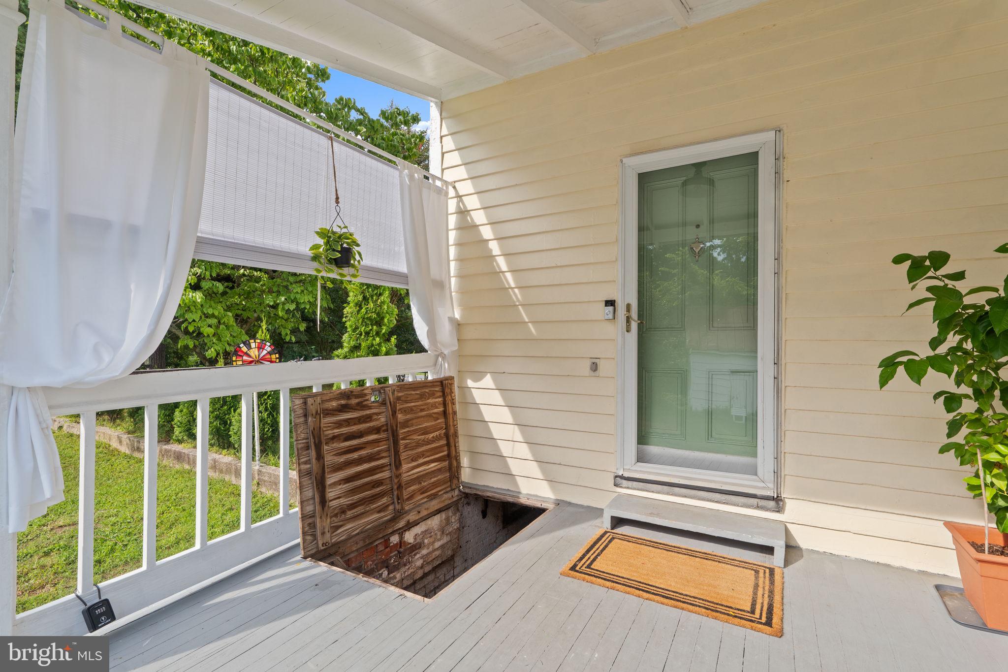 10007 Croom Road Upper Marlboro, MD 20772 - Photo 67 of 134 Back porch trap door to cellar