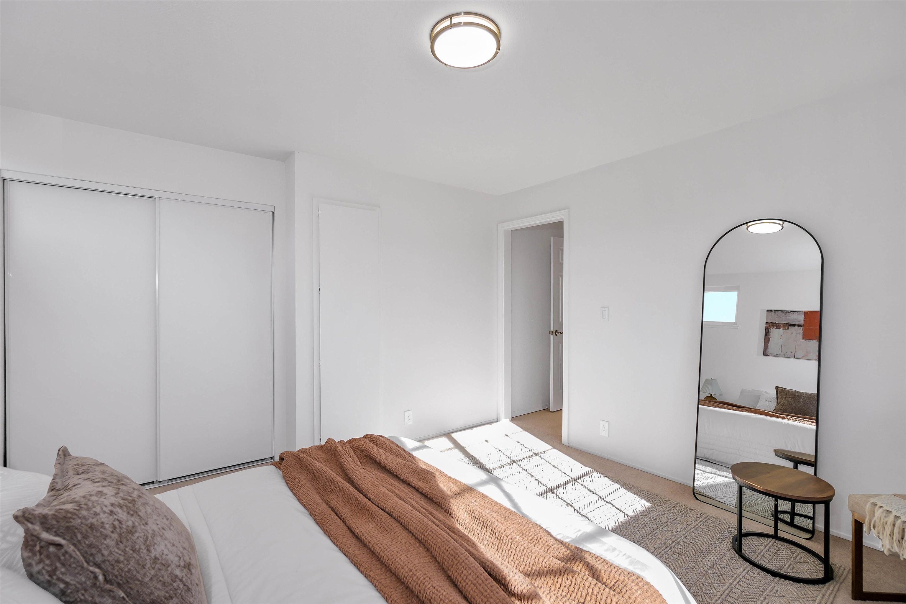 3159 Rowe Place Fremont, CA 94536 - Photo 13 of 59 a bedroom with a bed and a mirror