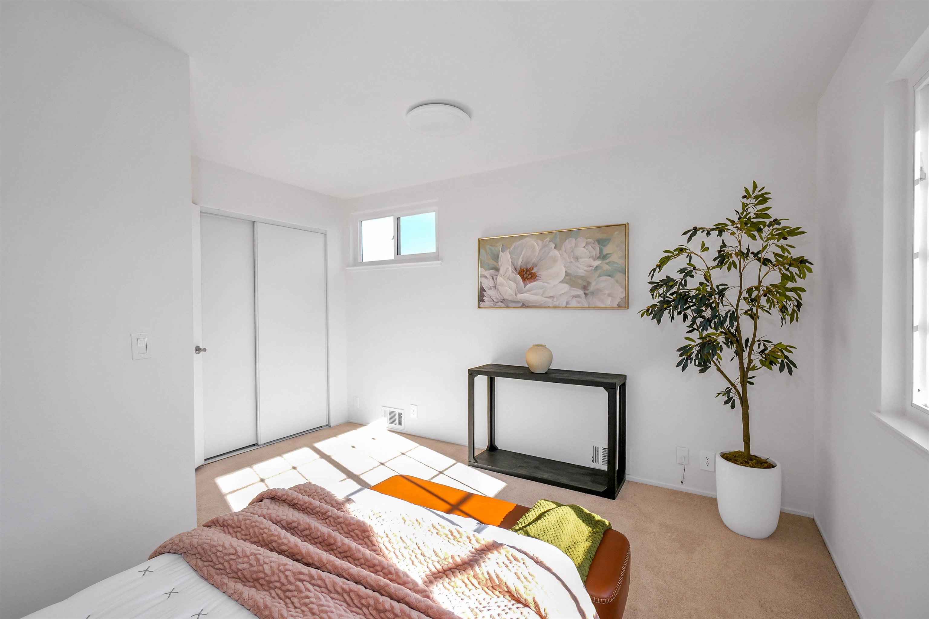 3159 Rowe Place Fremont, CA 94536 - Photo 17 of 59 a bedroom with a bed and a potted plant