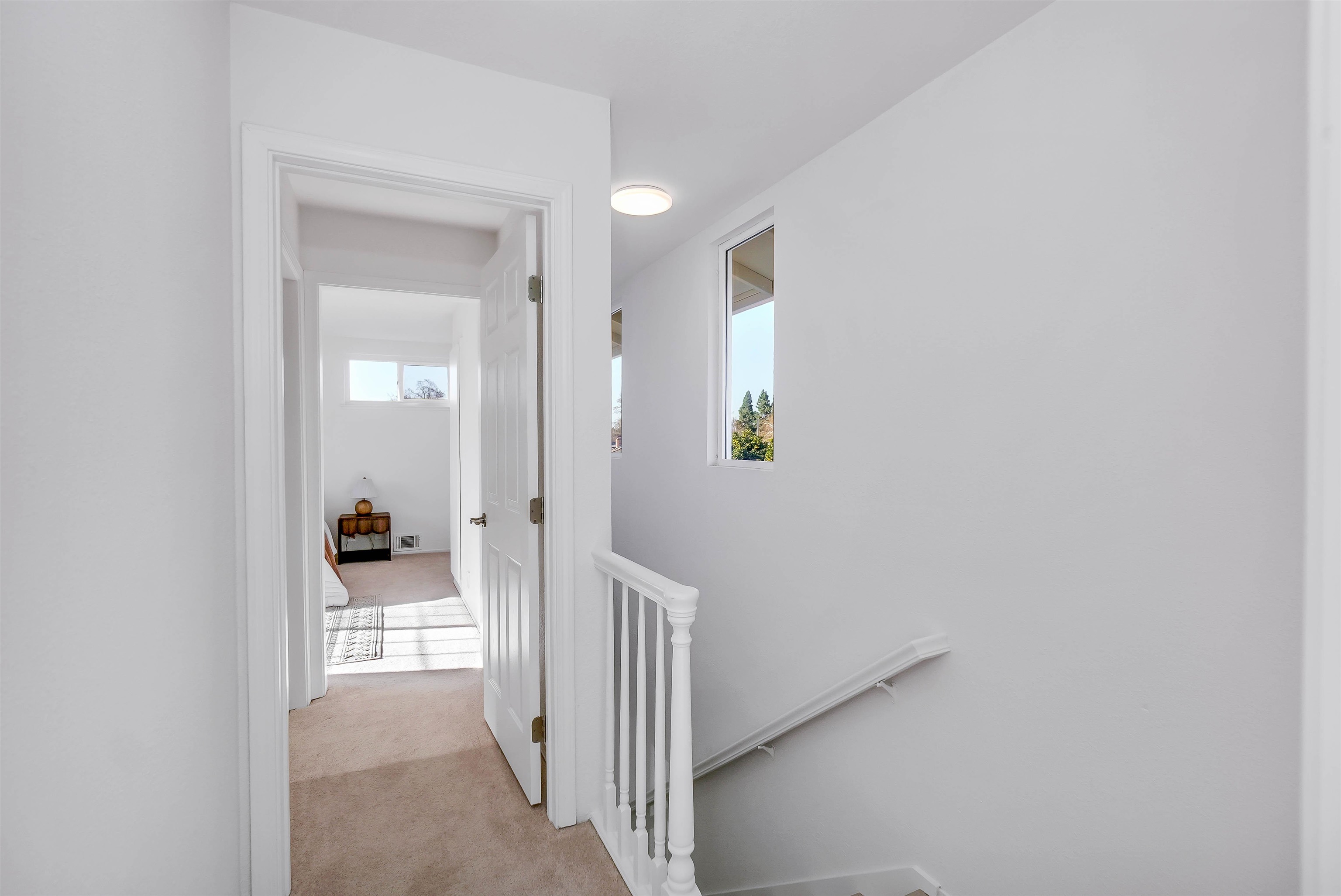 3159 Rowe Place Fremont, CA 94536 - Photo 18 of 59 a view of a hallway with wooden shelves