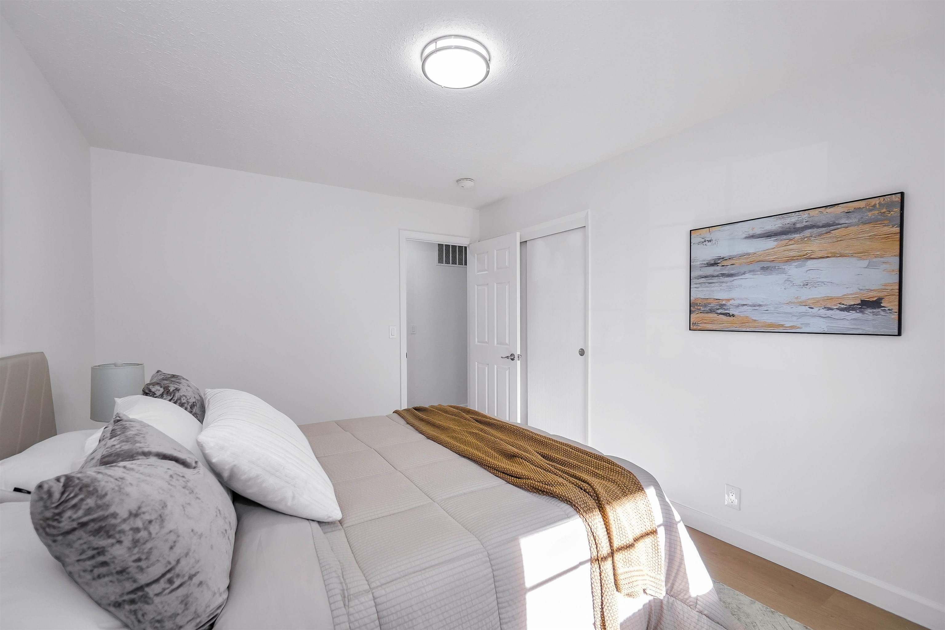 3159 Rowe Place Fremont, CA 94536 - Photo 32 of 59 a bedroom with a bed and a painting on the wall