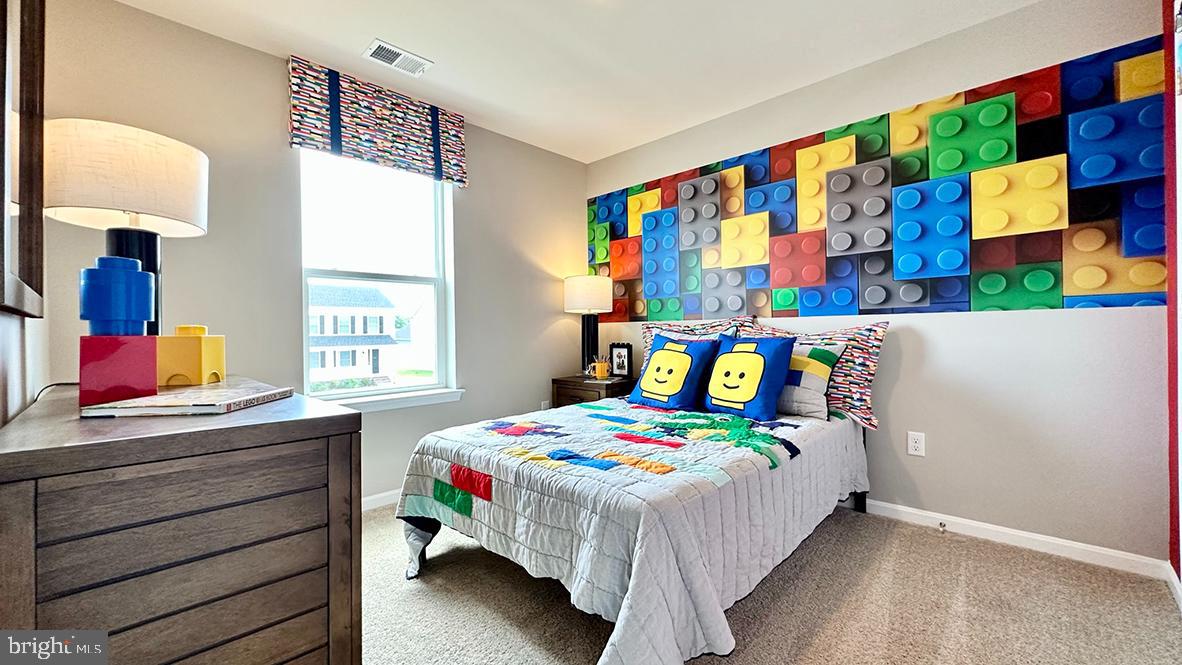 1152 Wintermead Loop Salisbury, MD 21801 - Photo 27 of 32 a bedroom that has a bed and a dresser in it