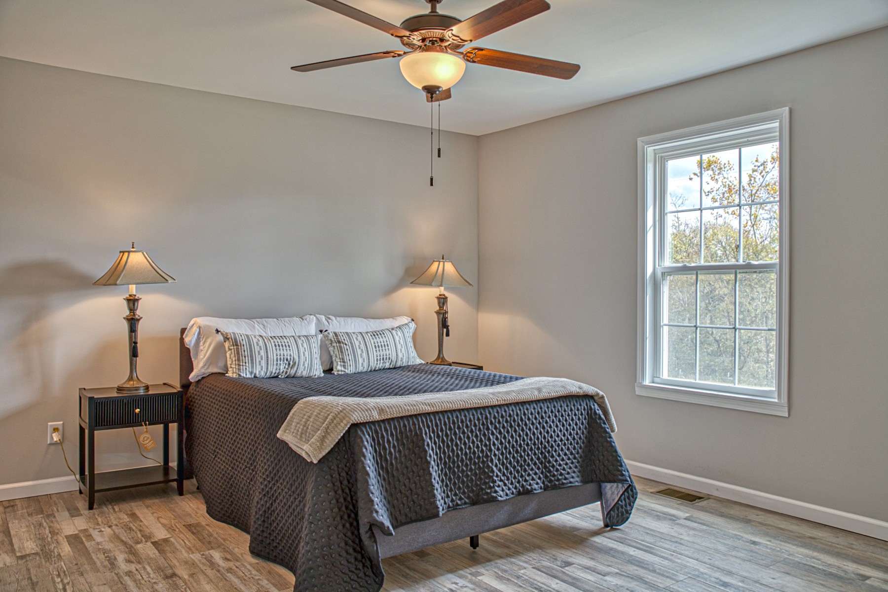 10309 Goff Ridge Road Baxter, TN 38544 - Photo 15 of 31 a bedroom with a bed and a chandelier