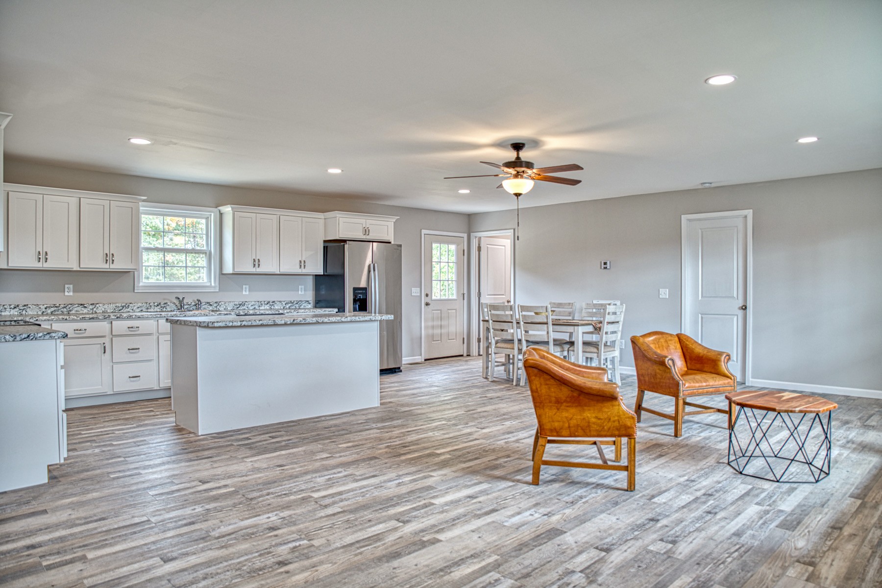 10309 Goff Ridge Road Baxter, TN 38544 - Photo 6 of 31 a kitchen with stainless steel appliances granite countertop a stove a sink and a refrigerator