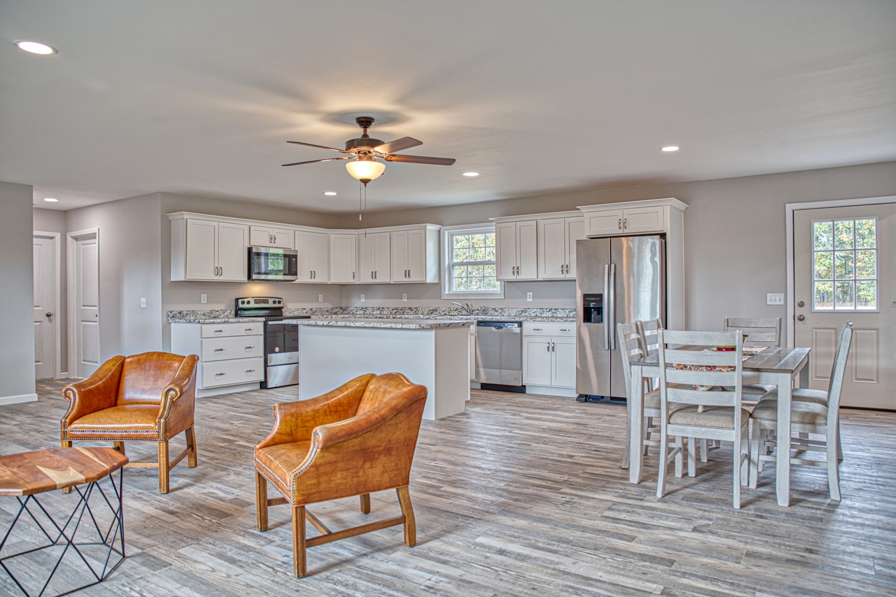 10309 Goff Ridge Road Baxter, TN 38544 - Photo 9 of 31 a living room with stainless steel appliances furniture dining table and wooden floor