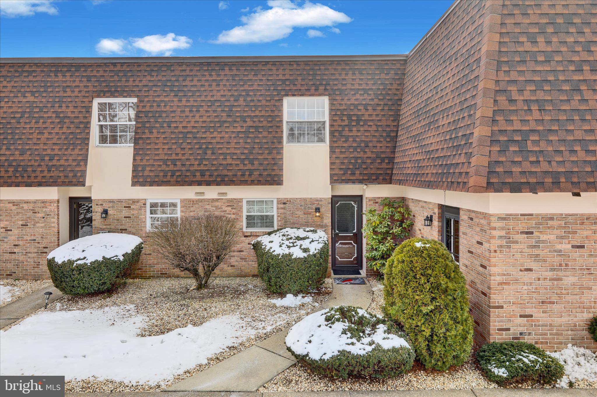 a view of a patio with table and chairs potted plants