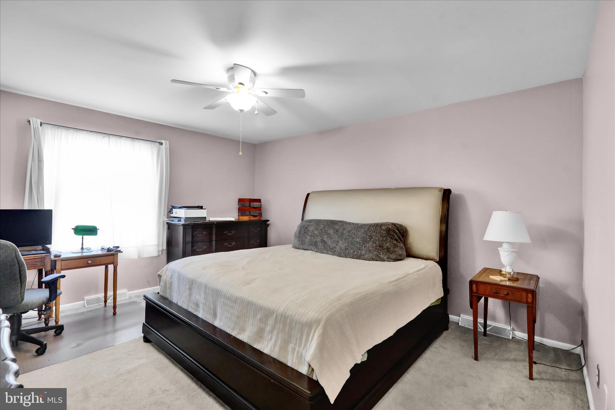 6 Alpine Court Reading, PA 19606 - Photo 15 of 22 a bedroom with a bed and a chandelier