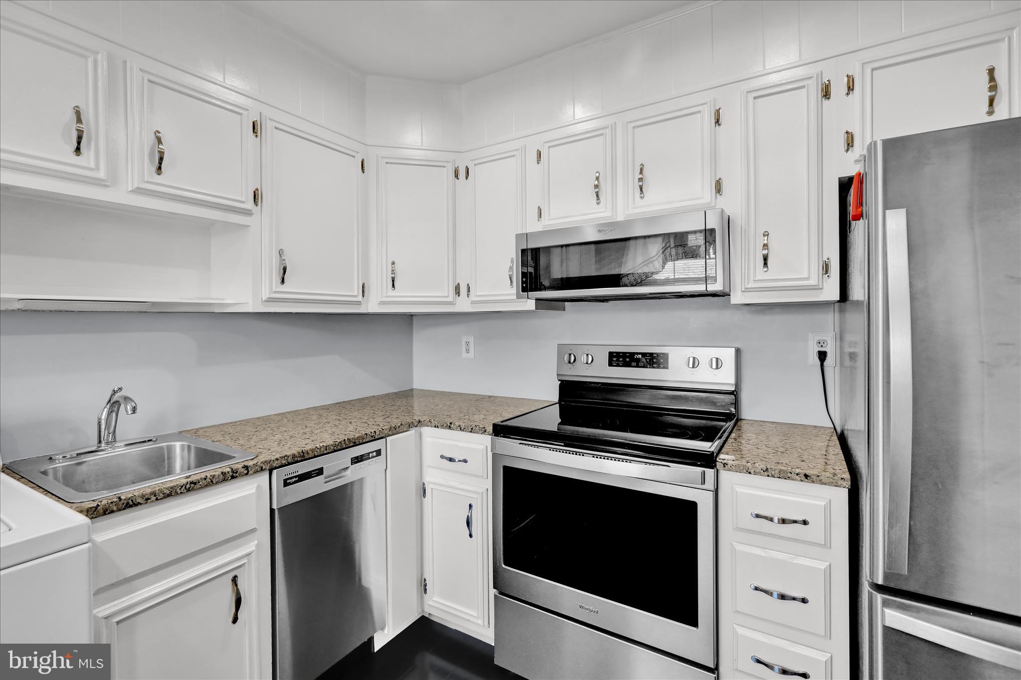 6 Alpine Court Reading, PA 19606 - Photo 9 of 22 a kitchen with white cabinets and stainless steel appliances