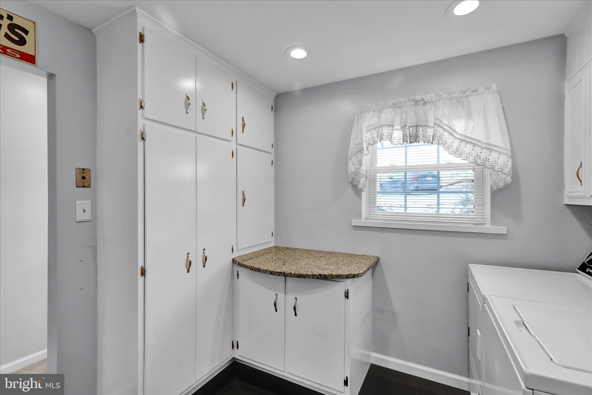 6 Alpine Court Reading, PA 19606 - Photo 10 of 22 a bathroom with a granite countertop sink a toilet a shower and a window