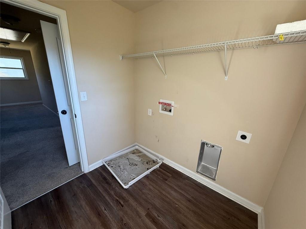 143 Massey Lane Locust Grove, GA 30248 - Photo 13 of 17 a view of an empty room with wooden floor and a window