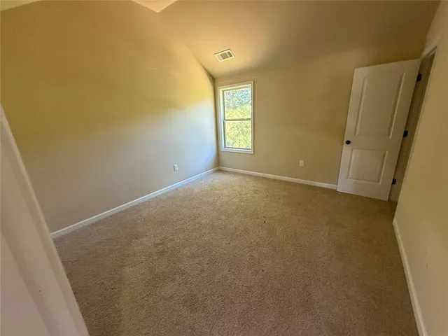 a view of an empty room and window