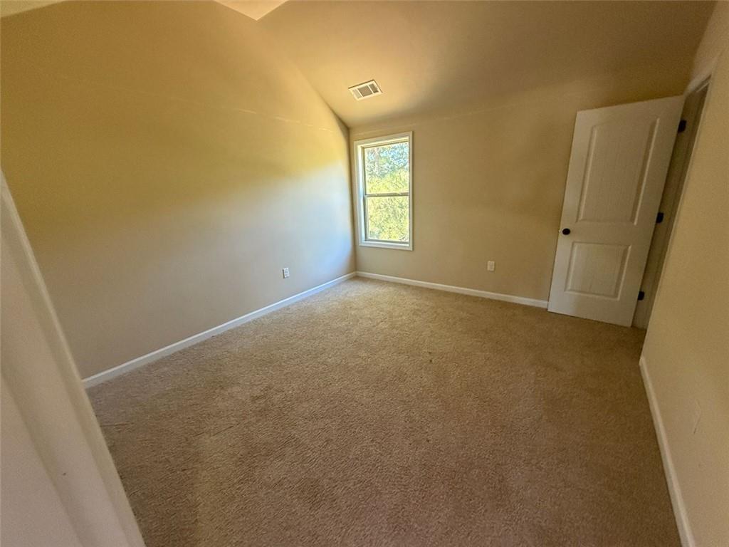 143 Massey Lane Locust Grove, GA 30248 - Photo 15 of 17 a view of an empty room and window