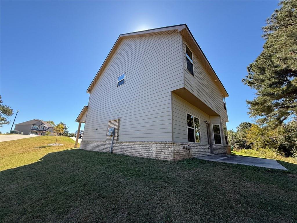 143 Massey Lane Locust Grove, GA 30248 - Photo 16 of 17 a view of house with backyard