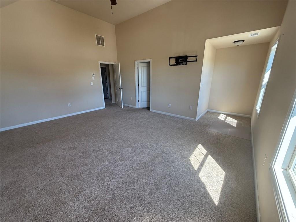 143 Massey Lane Locust Grove, GA 30248 - Photo 8 of 17 an empty room with windows and closet