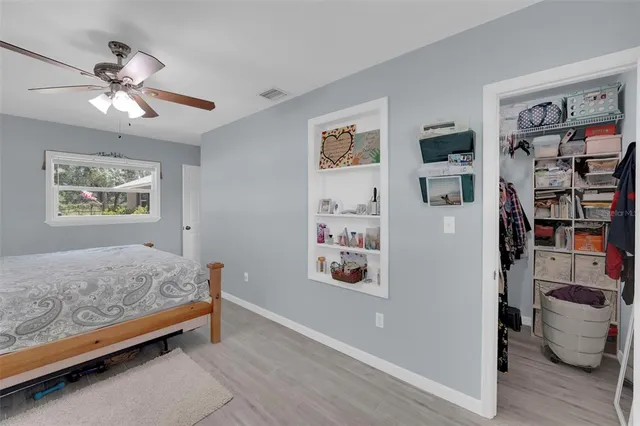 a bedroom with furniture and a window