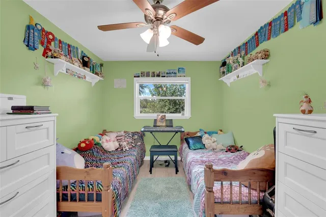 a bedroom with a bed and a table