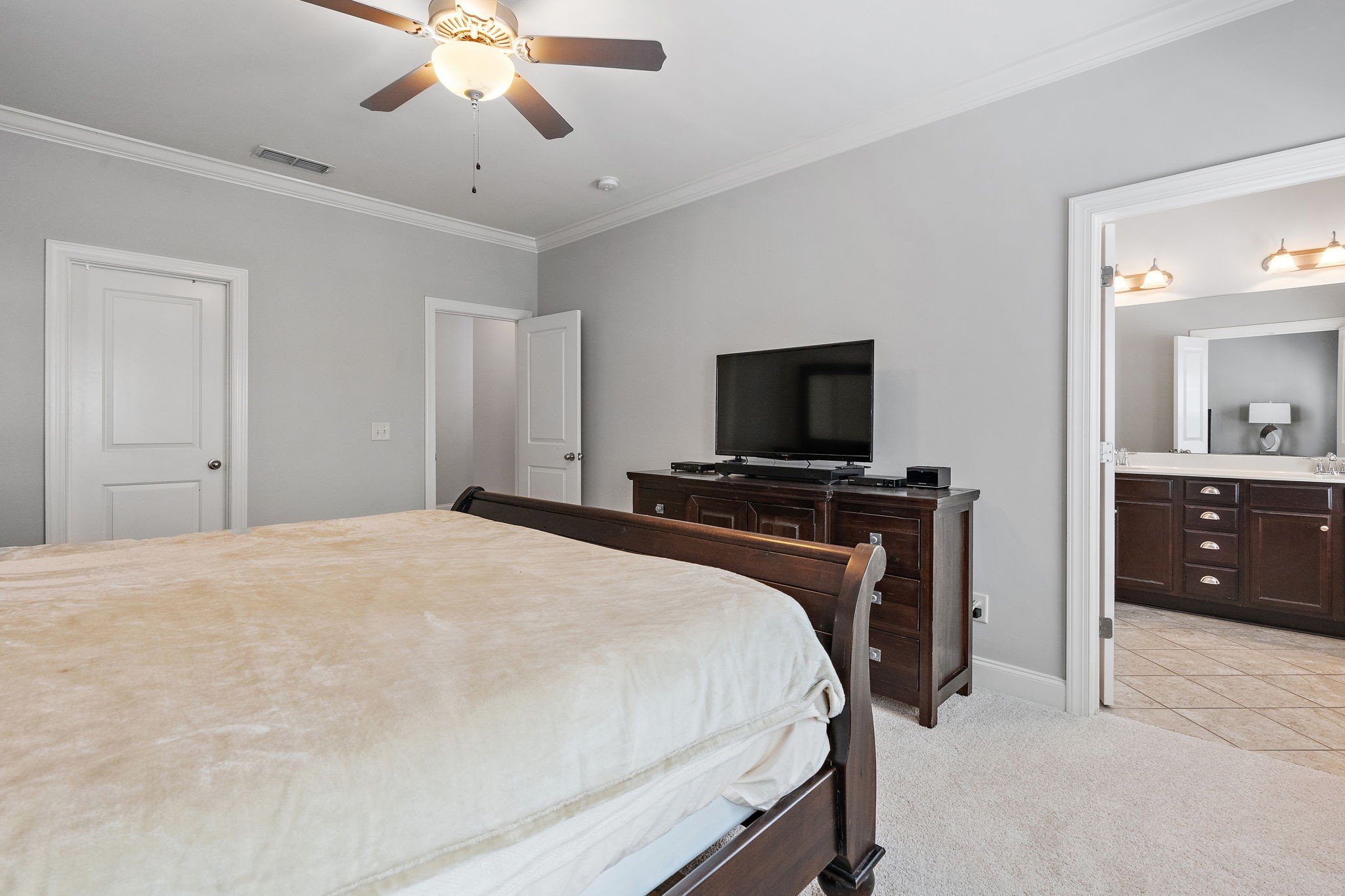 916 Gateway Court Franklin, TN 37069 - Photo 13 of 26 a bedroom with a bed and a flat screen tv