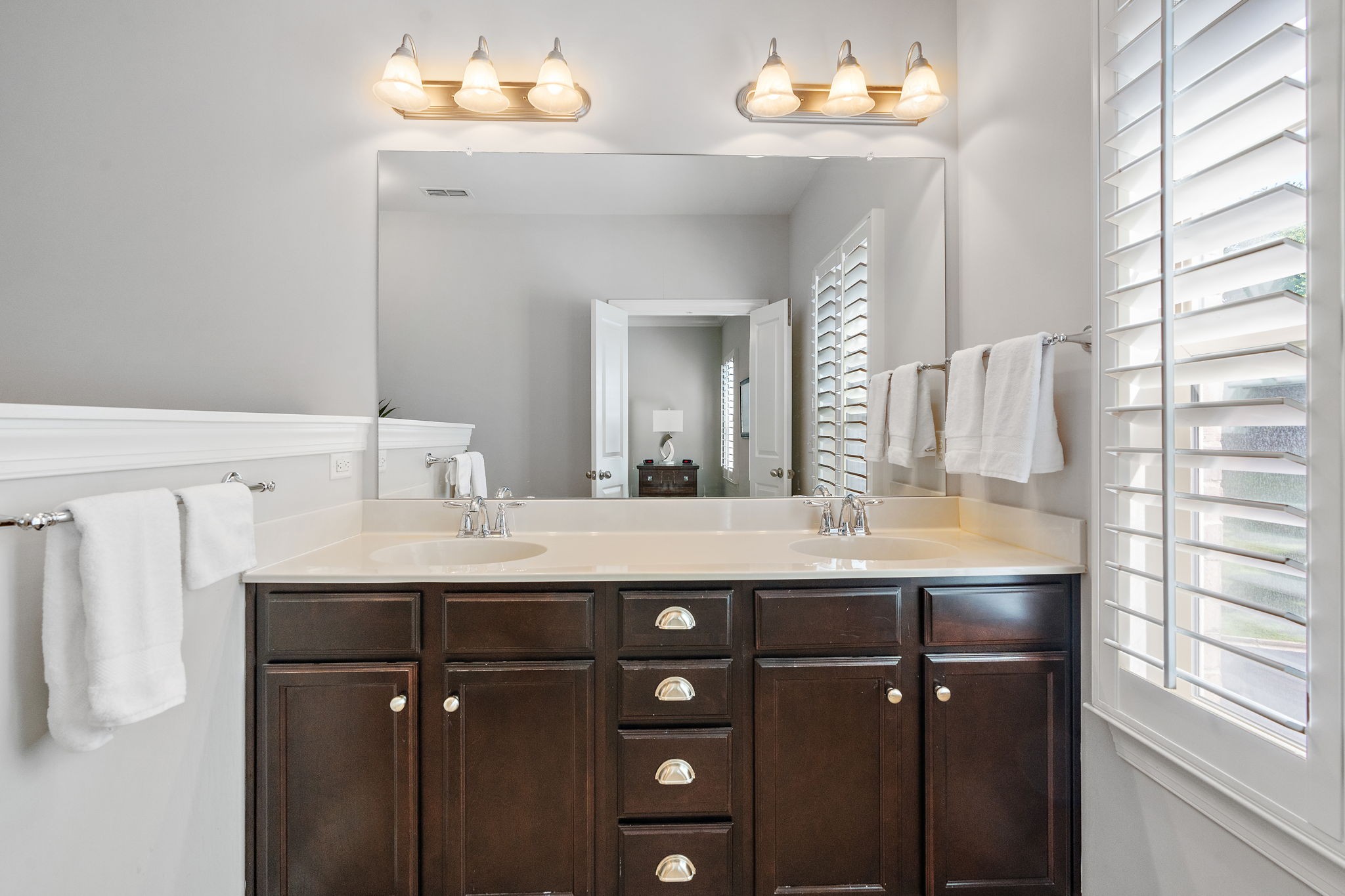 916 Gateway Court Franklin, TN 37069 - Photo 14 of 26 a bathroom with a double vanity and a mirror