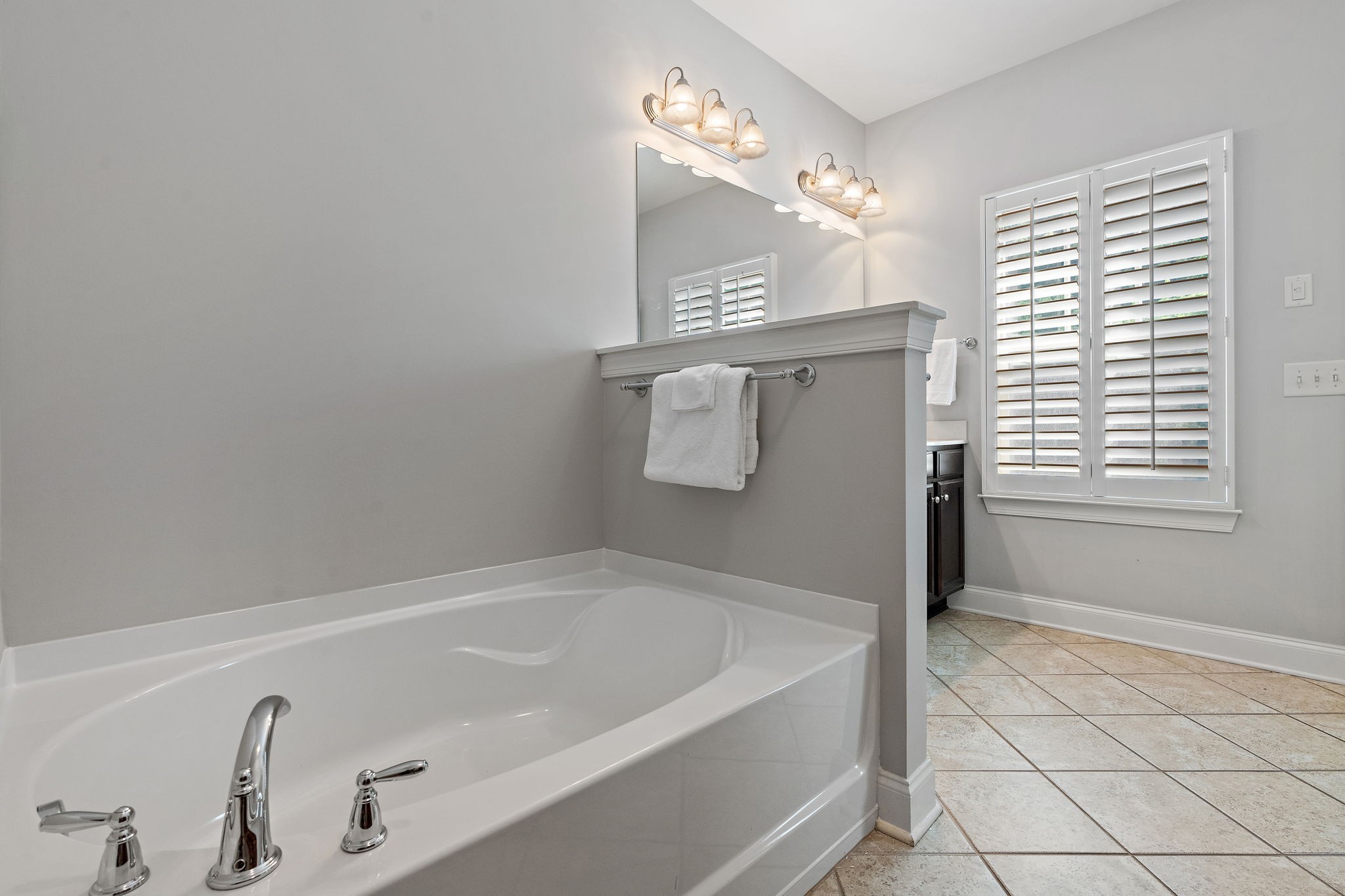 916 Gateway Court Franklin, TN 37069 - Photo 15 of 26 a bathroom with a bathtub and shower