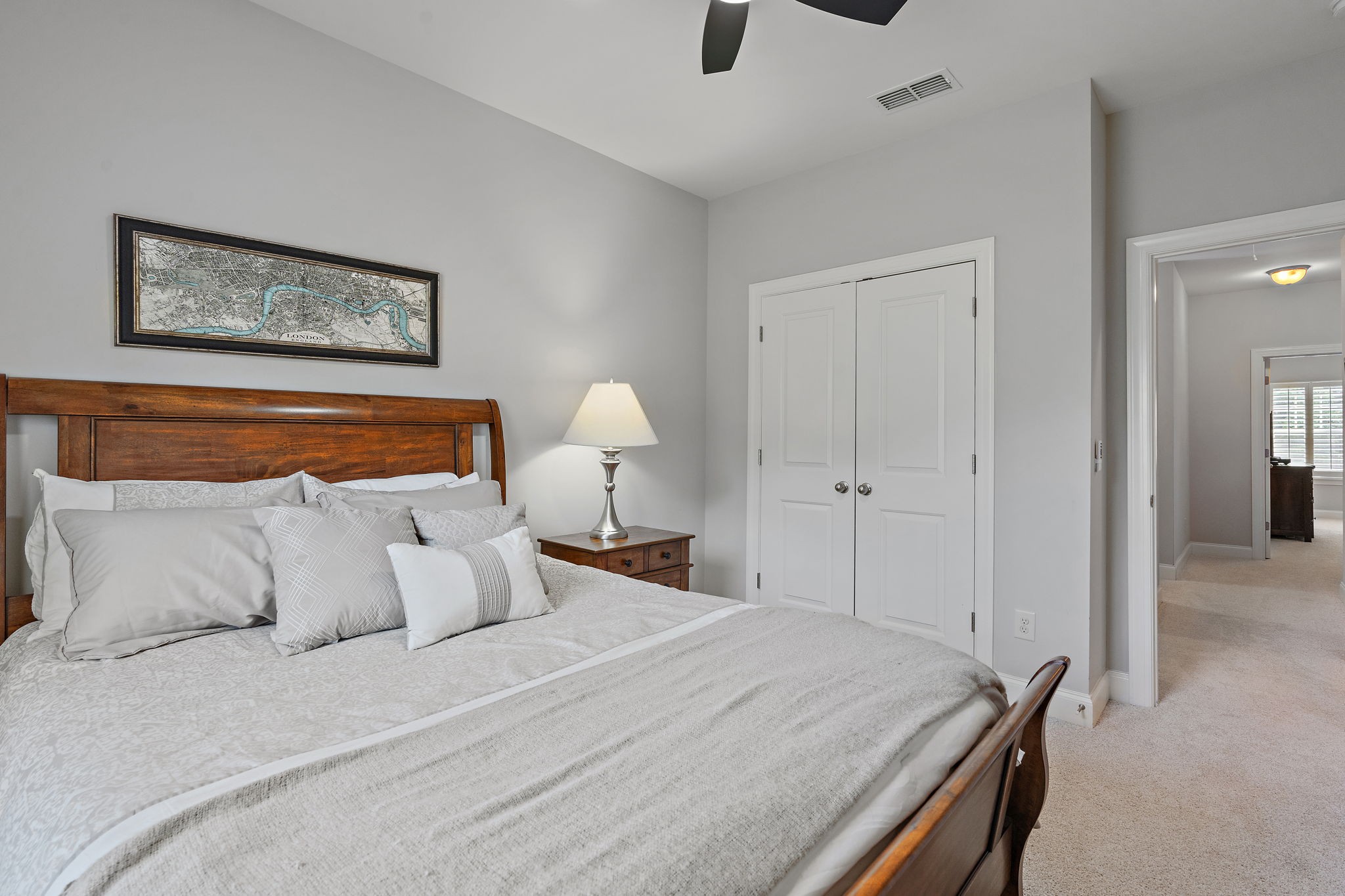 916 Gateway Court Franklin, TN 37069 - Photo 18 of 26 a bedroom with a bed and a lamp on table
