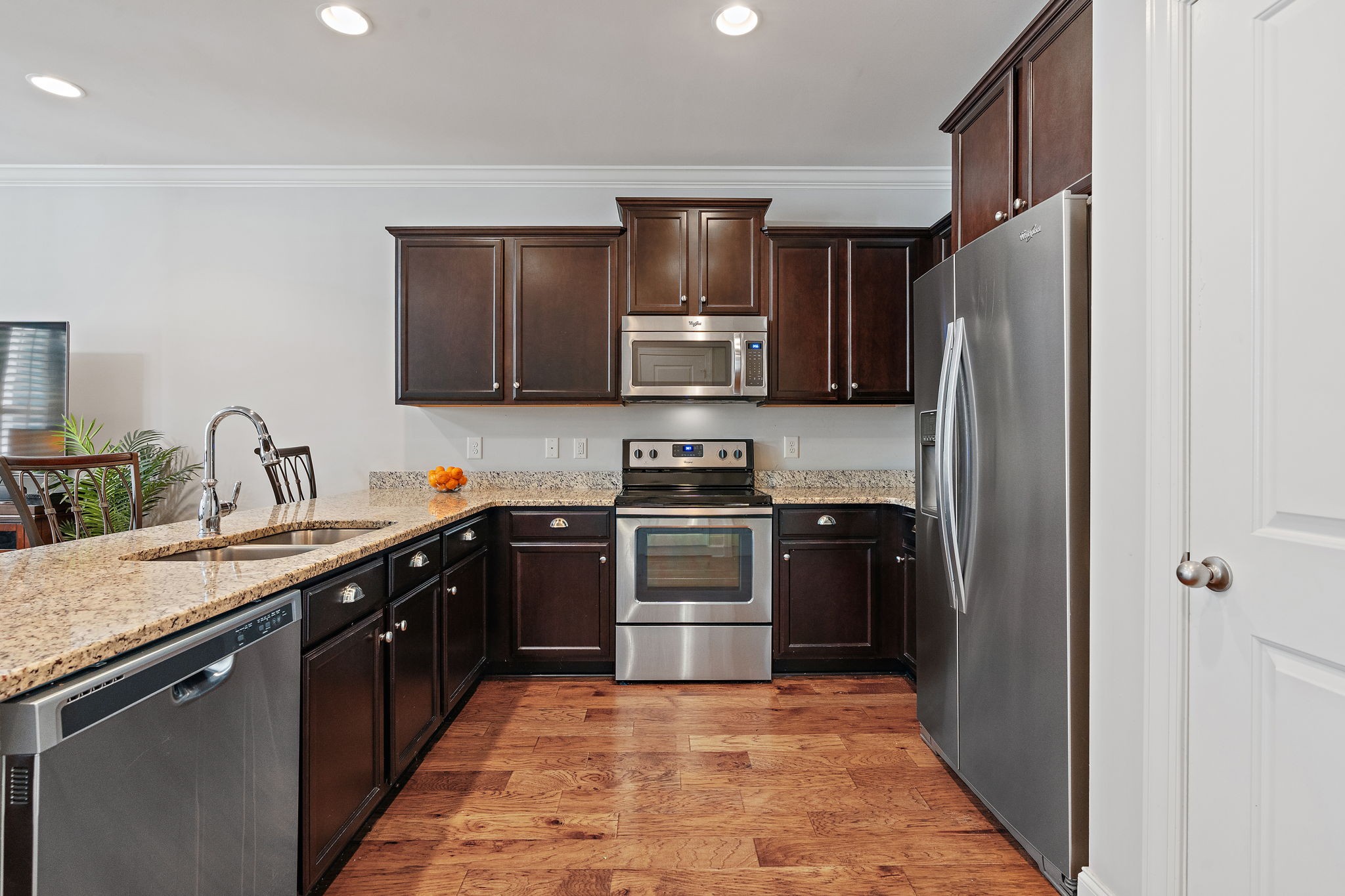916 Gateway Court Franklin, TN 37069 - Photo 9 of 26 a kitchen with stainless steel appliances granite countertop a refrigerator stove and sink