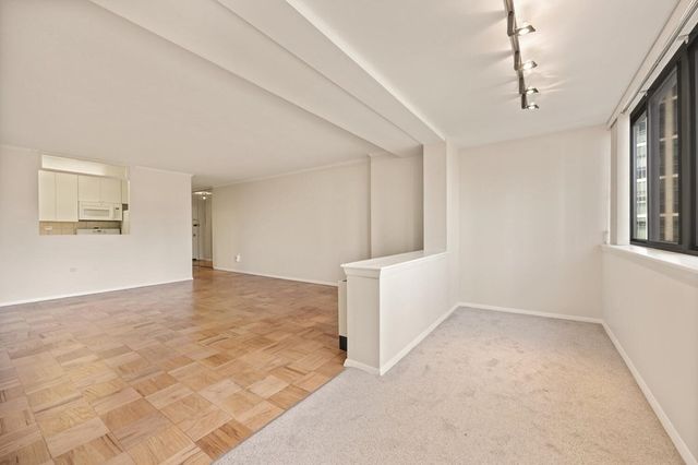 a view of empty room with windows