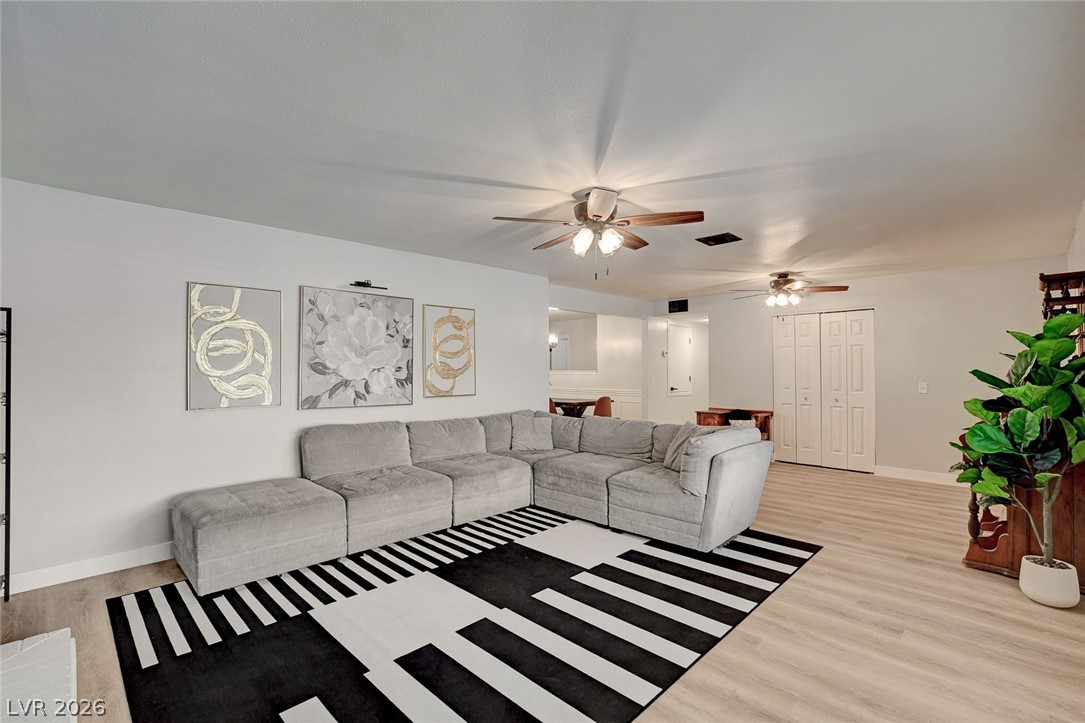 3765 Berkeley Street Logandale, NV 89021 - Photo 18 of 87 This versatile living area features ample space for gathering and stylish, durable LVP flooring throughout.