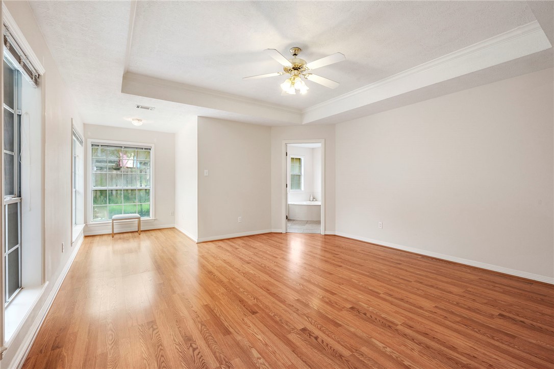 713 Willow Loop College Station, TX 77845 - Photo 15 of 39 a view of an empty room with wooden floor and a window