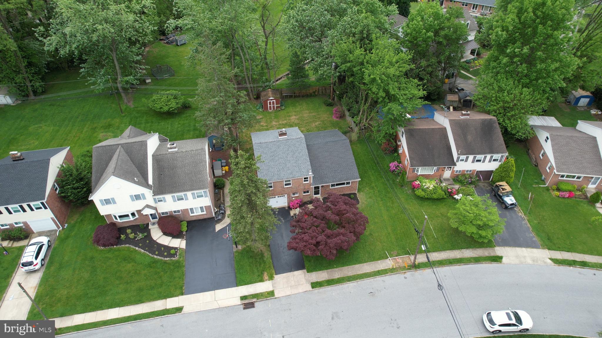 an aerial view of a house with outdoor space patio and garden
