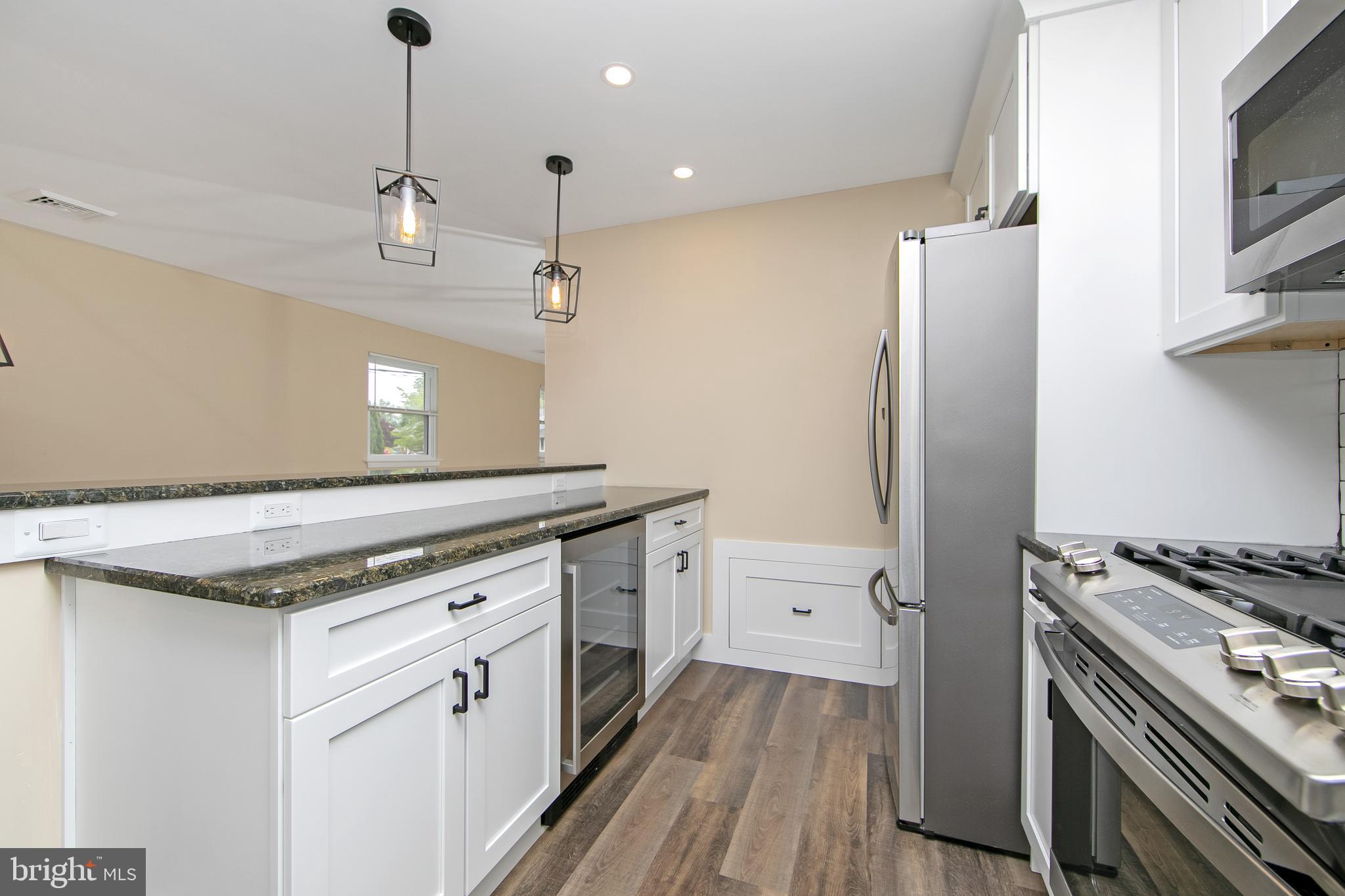 334 Parham Road Springfield, PA 19064 - Photo 13 of 41 a kitchen with a stove and a refrigerator